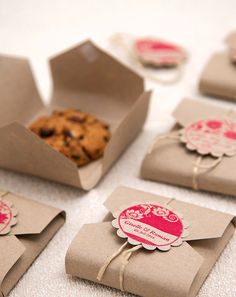 some brown paper bags with cookies in them