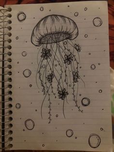 a drawing of a jellyfish on lined paper