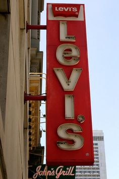 a large sign that says levi's elviss on the side of a building