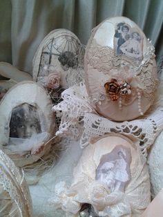 an arrangement of old fashioned hats with pictures on them and lace trimming around the edges