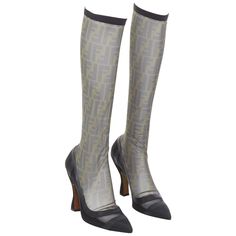 FENDI Colibri brown FF monogram sheer mesh sock boots EU40 Nicki Minaj Reference: TGAS/E00056 Brand: Fendi Model: Colibri As seen on: Nicki Minaj Material: Mesh, Leather Color: Black, Khaki Pattern: Monogram Closure: Elasticated Lining: Black Leather Extra Details: Fendi 'Colibri' FF logo sock boots in black, brown and grey mesh and a black suede heel. PVC sealed seams. Spool heels. Made in: Italy CONDITION: Condition: Good, this item was pre-owned and is in good condition. Please refer to image Spool Heels, Fendi Boots, Italian Boots, Manolo Blahnik Black, Mesh Socks, Sock Boots, Spool Heel, Caged Sandals, Donatella Versace