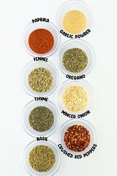 six bowls filled with different types of spices