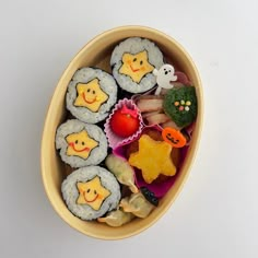 a bowl filled with different types of sushi