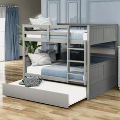 a bunk bed with two sets of mattresses on the bottom and one set below