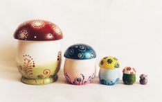 an assortment of colorfully painted ceramic mushrooms