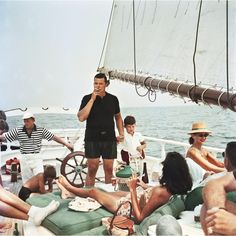 a group of people sitting on top of a boat