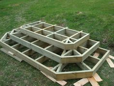 the wooden structure is ready to be built in the yard with wood planks around it