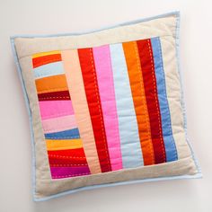 a pillow made out of strips of fabric