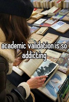 a woman reading a book in front of a table full of books with the caption,