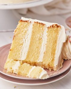 a slice of cake on a plate with white frosting