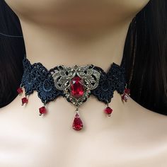 This vintage gothic styled crystal choker necklace features captivating Siam Red Swarovski crystals with nice crisp facets and brass embellishments. The detailed stampings have been in production since the 1940's and the vintage 16x11mm focal crystal is no longer in production, making this necklace a rare find. The lace is double-layered and hand sewn together for extra durability. Both elegant and stylish, this piece would be perfect for any formal occasion. Swarovski Crystals are made in Austr Lace Choker Necklace, Crystal Lace, Lace Choker, Crystal Choker Necklace, Vintage Gothic, Crystal Choker, Red Crystals, Gothic Jewelry, Jewelry Vintage