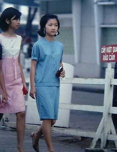 two women walking down the street together