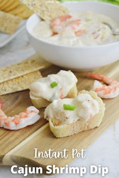 shrimp dip with crackers on a cutting board