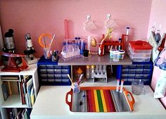 a toy kitchen with plastic containers and utensils