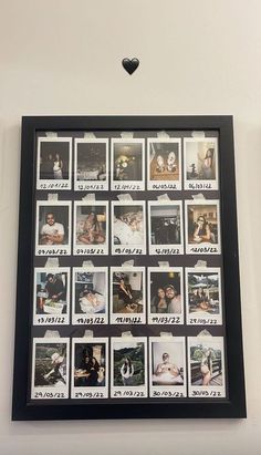 a black frame with pictures and hearts hanging on the wall