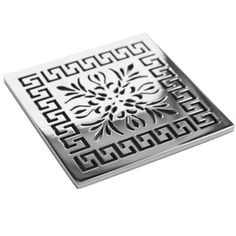 a square metal grate with an intricate design