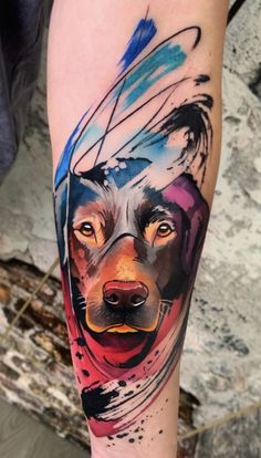 a colorful dog tattoo on the leg