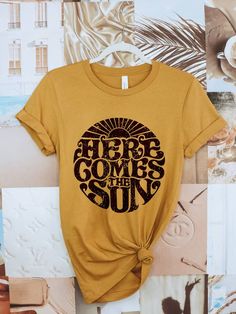 Let the sun into your wardrobe with this beautiful, screen printed tee. Wear it as a reminder to stay positive and enjoy life's little moments. Life is always brighter when you come out of the shadows and into the sunshine! 100% cotton Unisex fit Made in the USA Sun Graphic, Here Comes The Sun, Cool Graphic Tees, Here Comes, The Sunshine, Retro Design, Printed Tees, Retro Inspired, Summer Style