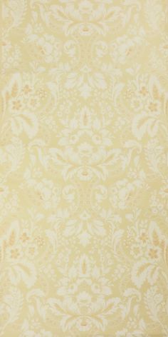 an old yellow and white wallpaper with floral designs