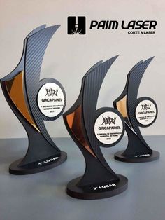 three trophies are shown with the palm laser logo on them, and one is black