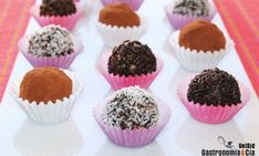 there are many different types of chocolates in the tray on the table, including one with white and brown sprinkles