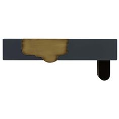 a black and gold door handle on a white wall with a brown pattered finish