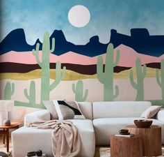 a living room with cactus painted on the wall