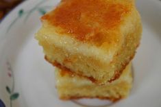 two pieces of cake sitting on top of a white plate