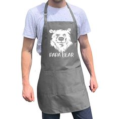 a man wearing an apron with the words papa bear on it and a bear's head