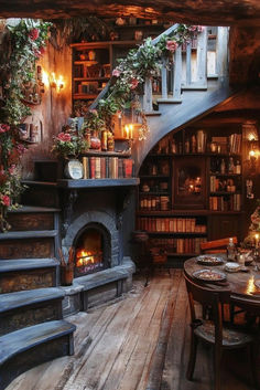 a room with stairs, tables and bookshelves filled with candles on the floor