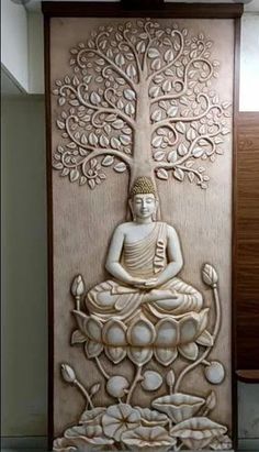 an intricately carved wall panel with a buddha sitting in lotuses and surrounded by flowers