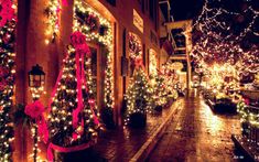 christmas lights adorn the streets of a town