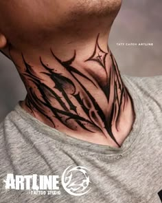 a man wearing a neck tattoo with black ink