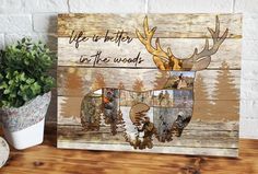 a wooden sign with deer pictures on it and the words life is better in the woods