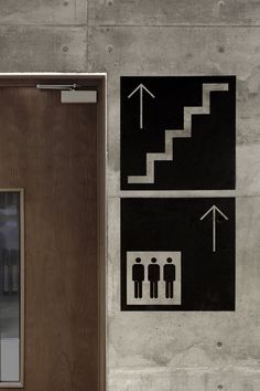 the door to an elevator has arrows pointing up and down