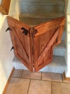 an open wooden door sitting on top of a set of stairs