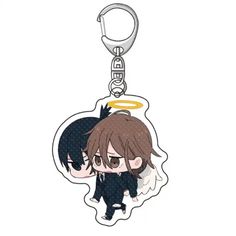 an anime key chain with a small angel on it's back and a black cat in