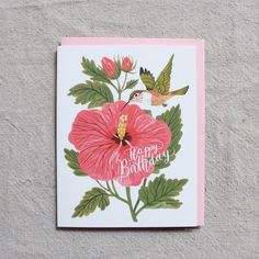 a birthday card with a hummingbird and pink hibise flower on the front