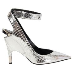 100% authentic Tom Ford pointed-toe wedge sandals in metallic silver python features a hidden ankle-strap buckle closure. Have been worn once and are in virtually new condition. Come with dust bag. Measurements Imprinted Size 37 Shoe Size 37 Inside Sole 23.5cm (9.2in) Width 7cm (2.7in) Heel 11cm (4.3in) All our listings include only the listed item unless otherwise specified in the description above. Vintage Pumps, Ballerina Pumps, Bow Pumps, Silver Pumps, Ankle Strap Wedges, Strap Wedge, Wedge Pumps, Ankle Strap Pumps, Strap Pumps