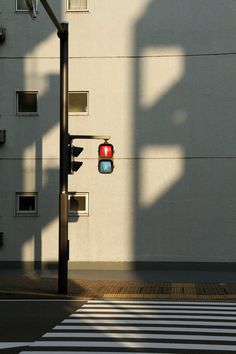 a traffic light sitting on the side of a building