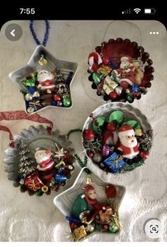 three christmas ornaments are sitting on a table