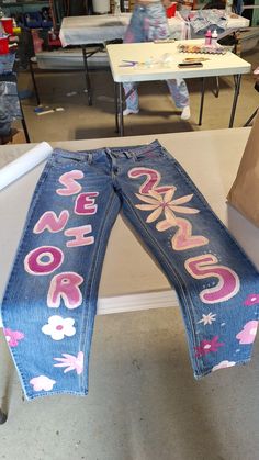 Hoco Shorts Painted, Spiderman Senior Jeans, Painted Homecoming Overalls, Senior Pants Aesthetic, Senior Jeans Vinyl, Senior Hoco Jeans Ideas, Purple Senior Jeans, Senior Jean Painting Ideas, Senior Jean Jacket