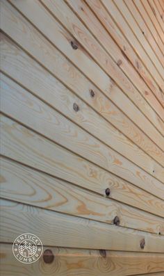 the side of a wooden building with wood slats