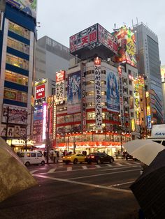 a busy city street filled with tall buildings