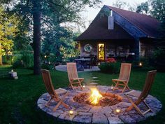 an outdoor fire pit with chairs around it and the words awesome backyard fire table above