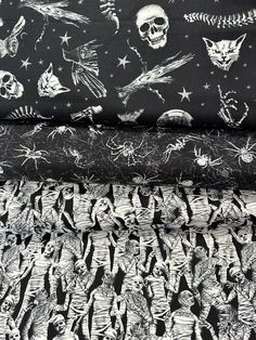 black and white fabric with skulls, stars and skeletons on them in various sizes and colors