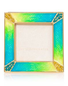 a blue, green and yellow photo frame with gold trimmings on the edges