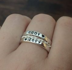 Use your imagination!! Your words on these beautiful stackable name ring sets make the perfect gift for yourself or someone special. These personalized rings are the perfect size to stack at 3 mm each and thicker than our other hammered, dainty rings. These are a polished sterling silver band, handstamped and oxidized to bring out your words then polished again to regain the remainder of the rings high polish. No two are the same and the hand stamped impressions add beauty and individuality to t Mom Rings Stackable, Personalized Stackable Rings, Stackable Name Rings, Accent Rings, Silver Initial Ring, Word Ring, Mommy Jewelry, Dainty Rings, Stackable Ring Sets