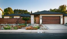 a house with landscaping in front of it