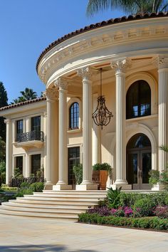 a large house with columns and pillars on the front